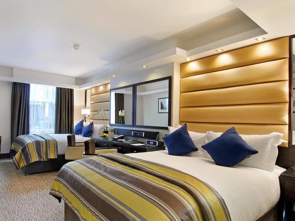 Park Grand Mayfair Londres Extérieur photo A bedroom at the Hilton London Paddington